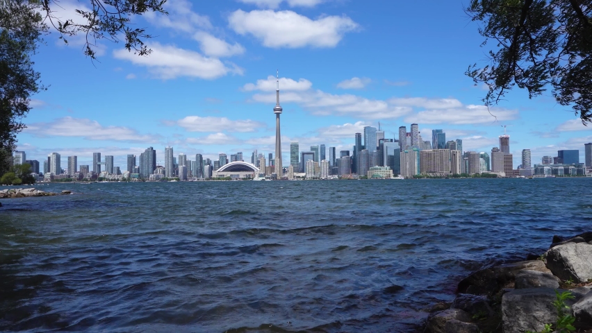 Toronto Islands shore. Toronto City downtown skyline in the background. Ontario, Canada.
