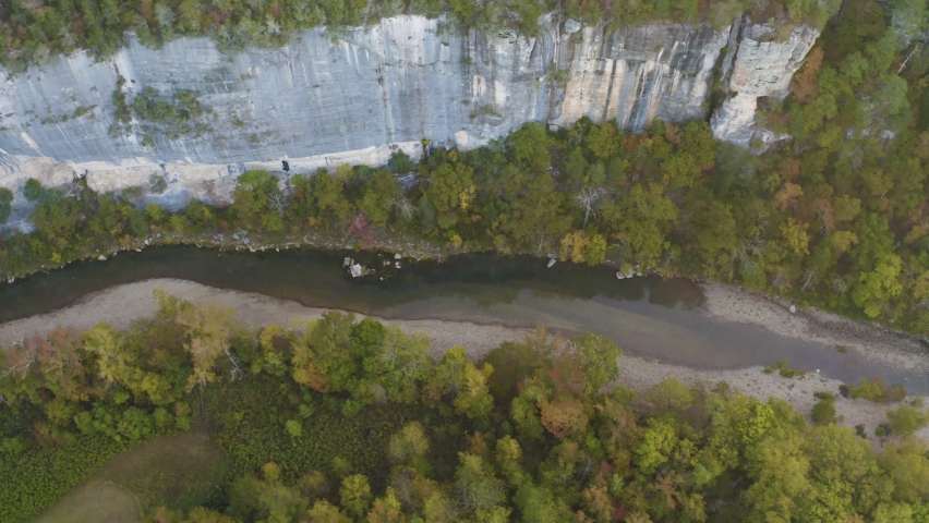 Aerial view of river with fall foliage landscape in northwest Arkansas during autumn season at sunrise - 4K Drone