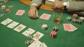 Poker players sitting near table and using mobile phone with green screen . man holding phone during game . Mobile phone on poker table . Concept of  betting or online casino games .  - Powered by Shutterstock - Get 15% off with code: PIKWIZARD15