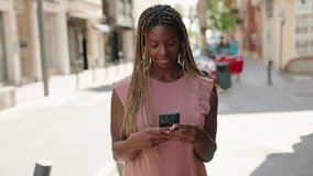 African american woman smiling confident making selfie by the smartphone at street - Powered by Shutterstock - Get 15% off with code: PIKWIZARD15