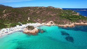Sardegna island best beaches in Costa Smeralda (emerald coast), aerial drone video of Capriccioli  beach. Italy summer holidays