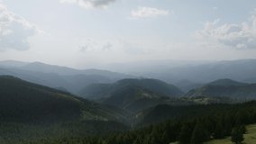 Aerial view of the Carpathian Mountains in Romania. Transalpina, Transfagarasan, summer, green trees, drone, highlands, scenery, valleys. 4K 50fps Drone Video Footage