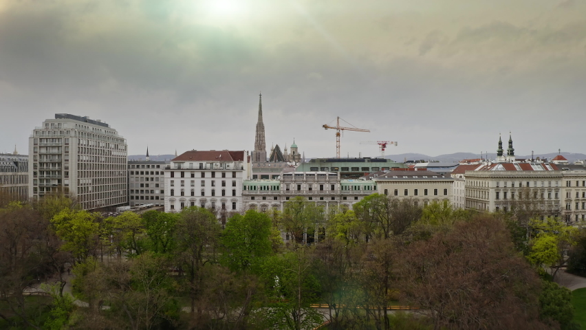 Establishing aerial view of Austrian capital beautiful popular city Vienna european town cityscape with old historical buildings and modern skyscraper in centre Stephansplatz square at cloudy weather