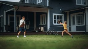 Young Athletic Father Playing Ball with His Young Son. Dad Teaching the Boy to Play American Football. Kid Learning to Throw the Rugby Ball Correctly. Family Members Playing Outside Their Home. - Powered by Shutterstock - Get 15% off with code: PIKWIZARD15