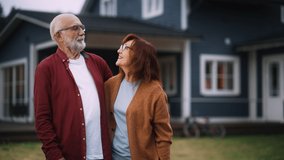 Joyful Senior Couple are Laughing and Having Fun Outdoors Their Country House, Lovingly Embracing Each Other. Adults Look at the Camera and Smile, Enjoy Their Active Retirement Life. - Powered by Shutterstock - Get 15% off with code: PIKWIZARD15