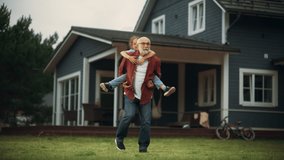 Happy Granddad Enjoying Time Outdoors with His Grandchild, Playing with Energetic Young Girl. Joyful Grandpa Giving a Piggyback Ride on a Lawn in Front of the House. - Powered by Shutterstock - Get 15% off with code: PIKWIZARD15