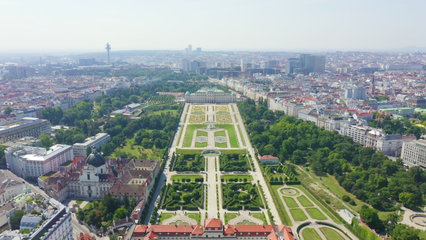 Inscription on video. Vienna, Austria. Belvedere is a baroque palace complex in Vienna. Built by Lucas von Hildebrandt at the beginning of the 18th century. Glitch effect text, Aerial View, Departure