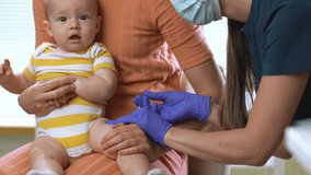 Female pediatric nurse doctor vaccinating baby. Concept of vaccination program, children's vaccination, prevention of infectious diseases, anti-coronavirus vaccination - Powered by Shutterstock - Get 15% off with code: PIKWIZARD15