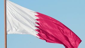 Elegant Qatar flag flying in the sky on a bright sunny day in slow motion
 - Powered by Shutterstock - Get 15% off with code: PIKWIZARD15