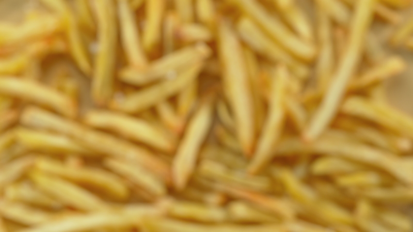 Super Slow Motion Shot of French Fries and Salt Flying Towards Camera at 1000fps. Royalty-Free Stock Footage #1095992085