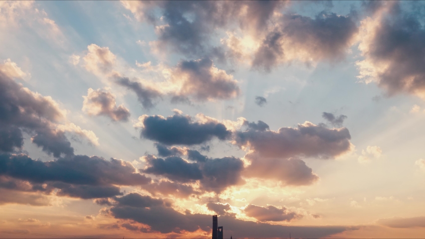 4K time lapse of Majestic sunset landscape. Amazing light of nature cloudscape sky and Clouds moving away rolling colorful sunset time. Nature environment background with silhouette Shanghai landmarks