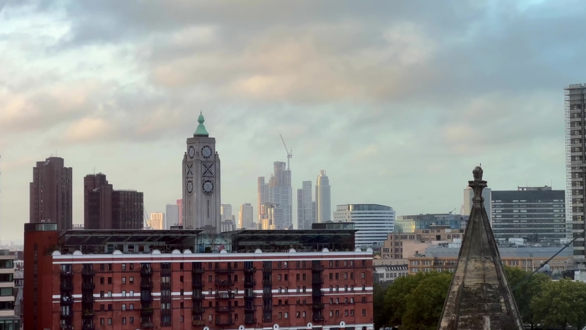 Oxo Tower on south bank in London. City skyline with sunrise sky Royalty-Free Stock Footage #1096018031