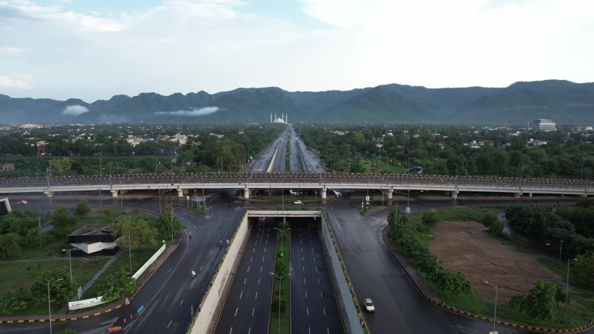 Islamabad Expressway, Faisal Avenue, A beautiful Road And margalla hills with Faisal Faisal Mosque drone view, Islamabad expressway flyover  Royalty-Free Stock Footage #1096020127