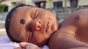 New Born Baby Girl Laying On Direct Sunlight. Sun Exposure in Children Benefits of increased Vitamin D, Serotonin Levels, Insulin Levels, Manages Jaundice, and Higher Energy Levels. - Powered by Shutterstock - Get 15% off with code: PIKWIZARD15
