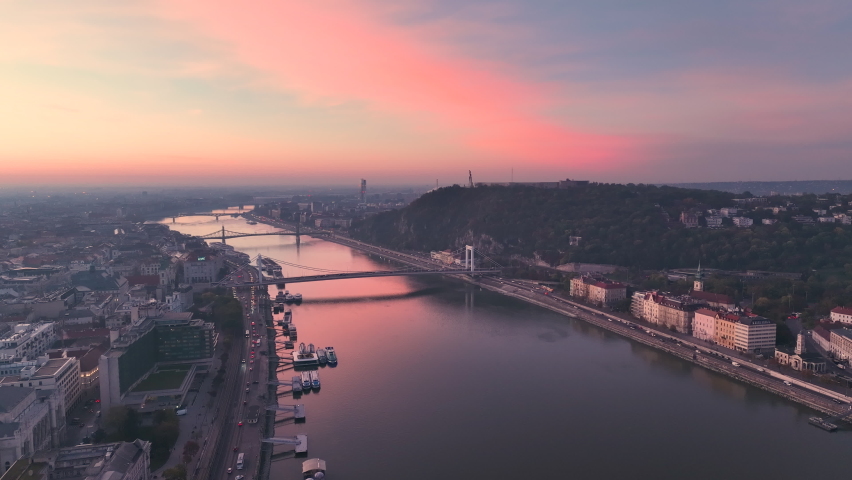 Aerial view of Budapest city skyline at sunrise. Elisabeth Bridge, the third newest bridge of Budapest, Hungary, connecting Buda and Pest across the River Danube | Shutterstock HD Video #1096024453