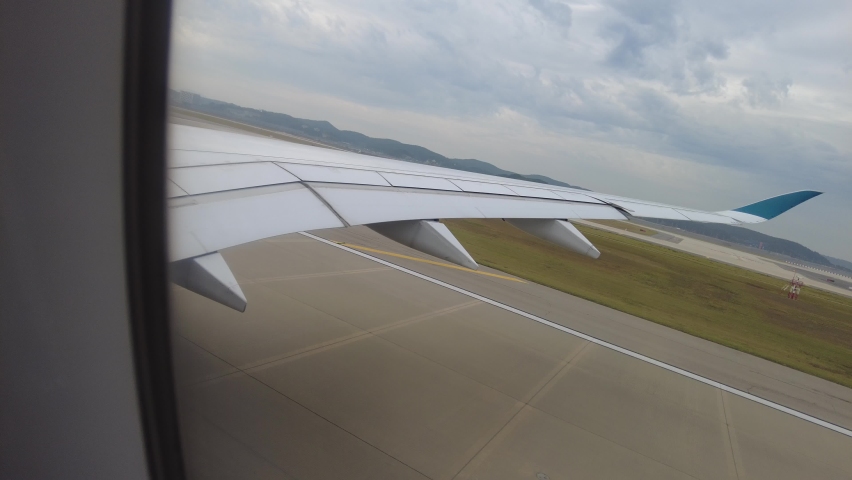 Hyperlapse wing view with plane takes off in Incheon Korea airport.