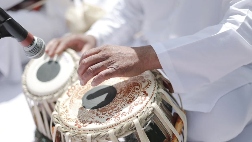 Tabla Yoga Music. Close-up of hands of an Indian man playing a paired tabla drum.  Royalty-Free Stock Footage #1096034043