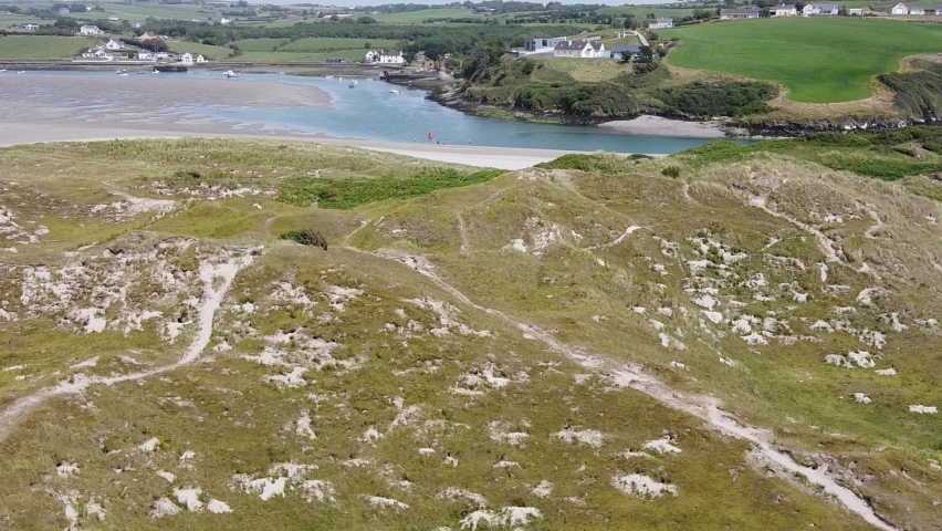 Top view of the dunes, marram grass. The coast of Ireland. A picturesque landscape. Dunes, video.