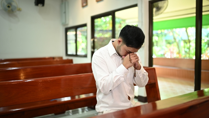Christian man asking for blessings from God, Asian man praying to Jesus Christ | Shutterstock HD Video #1096037153