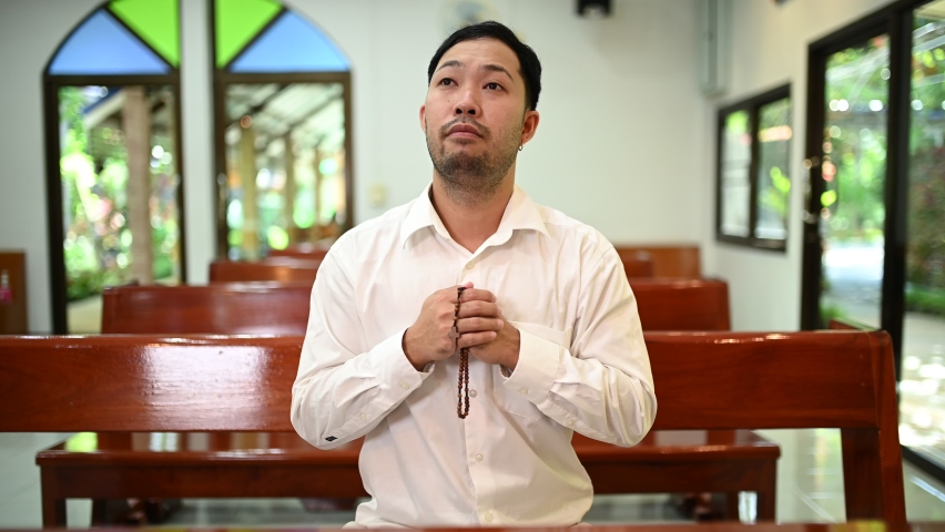 Christian man asking for blessings from God, Asian man praying to Jesus Christ | Shutterstock HD Video #1096037155