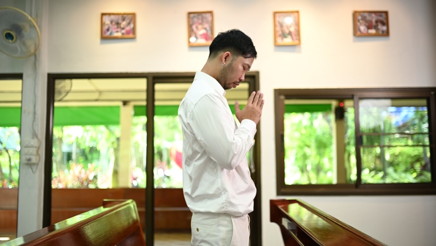 Christian man asking for blessings from God, Asian man praying to Jesus Christ | Shutterstock HD Video #1096037159