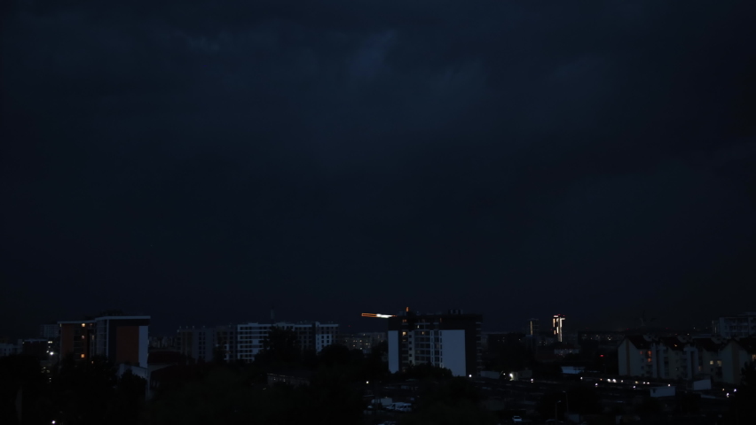 Lightning city in light. Thunderstorm town in light. Flash thunderstorm flash over the city at night sky lightning storm over urban. Low key lighting. Underexposed. Pink light Royalty-Free Stock Footage #1096037535