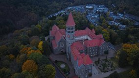Aerial drone Shot of Abbey in Clervaux, Luxembourg in mystery evening twilight 