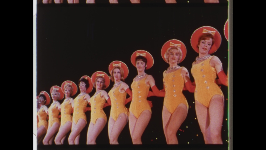 1960 Las Vegas, NV. Showgirls perform synchronized line dance. rehearsing a chorus line number. 4K Overscan of Vintage Archival Newsreel Film