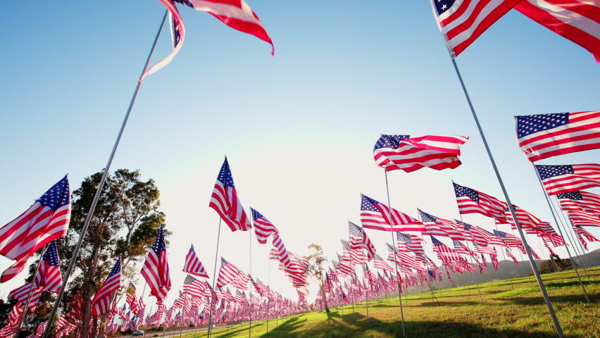 View on Waves of Flags on annual ceremony at Pepperdine University, CA, USA. Shot of honoring the lives lost in the terror attacks on September 09,11, 2001. High quality 4k footage Royalty-Free Stock Footage #1096052521