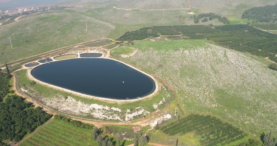 Aerial view of reservoir in a shape of a big foot. Amiad, Northern district, Israel