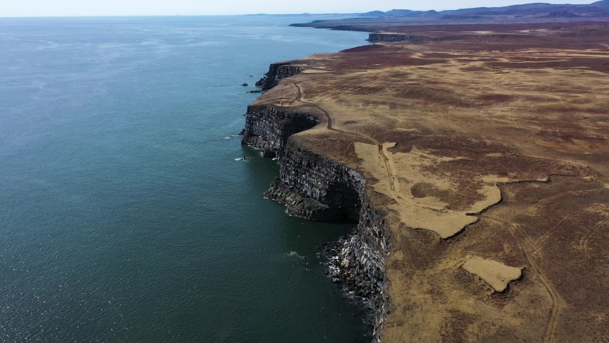 Aerial view of Krysuvikurberg cliffs along the coast in Iceland. Royalty-Free Stock Footage #1096059247
