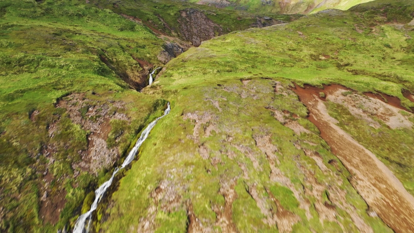 Aerial view of a small river streaming along the mountain on Unalaska island, Alaska, United States.