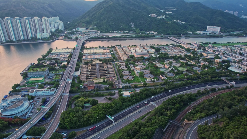 Sunrise aerial view of the Sha Tin Sewage Treatment Works, HKSAR Government Facility Royalty-Free Stock Footage #1096065483