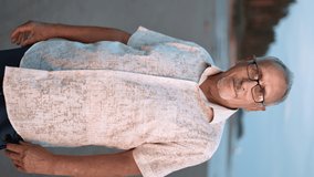 VERTICAL VIDEO POV elderly man happy tanned tourist posing at sunset beach sea forest resort landscape. Portrait smiling travel 70s grandfather enjoy seaside travel vacation relaxing at coast scenery - Powered by Shutterstock - Get 15% off with code: PIKWIZARD15