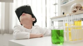 asian boy using VR goggles technology for virtual mixing chemical liquid in school laboratory.  young scientist learning chemical class with 3d virtual education technology.   - Powered by Shutterstock - Get 15% off with code: PIKWIZARD15