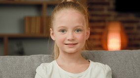 Cute girl small child caucasian baby looking at camera portrait beautiful kid face friendly emotion posing at home room close up female portrait young teenage schoolgirl toddler pupil joyful smiling - Powered by Shutterstock - Get 15% off with code: PIKWIZARD15