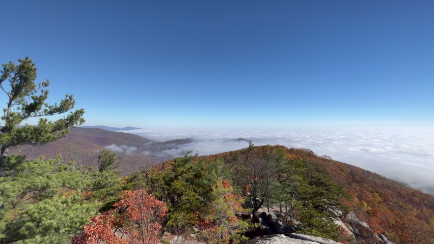 Old Rag Mountain in Virginia’s Shenandoah National Park on a gorgeous autumn day with a cloud inversion. The camera pans from left to right.