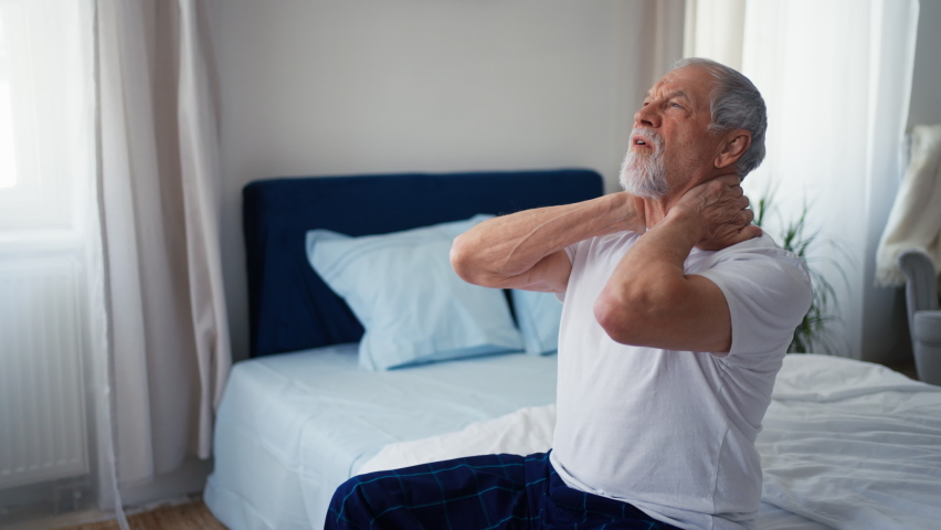 Senior man suffering neck pain.