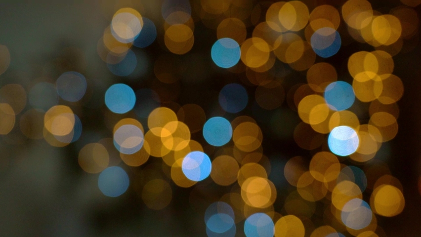 Christmas tree in interior with defocused lights and star. Christmas abstract blur background. Out of focus holiday background with christmas tree. Light bokeh from Xmas tree. Xmas and New Year theme. | Shutterstock HD Video #1096098201