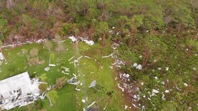 4K Drone Video of Debris in Pine Trees from Homes Destroyed by Hurricane Ian in North Port, Florida - 21
