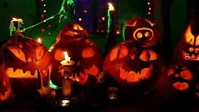 Halloween Background with Handmade Carved Pumpkins Jack O' Lanterns With Candles, Smoke and LIghts