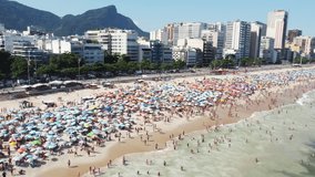Scenic aerial video of Ipanema beach and Atlantic ocean in Rio de Janeiro, one of the most popular tourist destinations in Brazil.