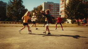 Brave Girl Playing Soccer with Neighborhood Boys. Young Football Player Dribbling, Kicking a Ball Successfully to Score a Goal. Diverse Friends Hug and Celebrate the Victory. Action Tracking Shot. - Powered by Shutterstock - Get 15% off with code: PIKWIZARD15