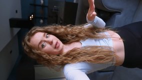 Curly woman talking on vertical selfie video on live stream at social network platform for subscribers, followers. Gen z blogger girl filming on smartphone camera. Female recording in online chat - Powered by Shutterstock - Get 15% off with code: PIKWIZARD15