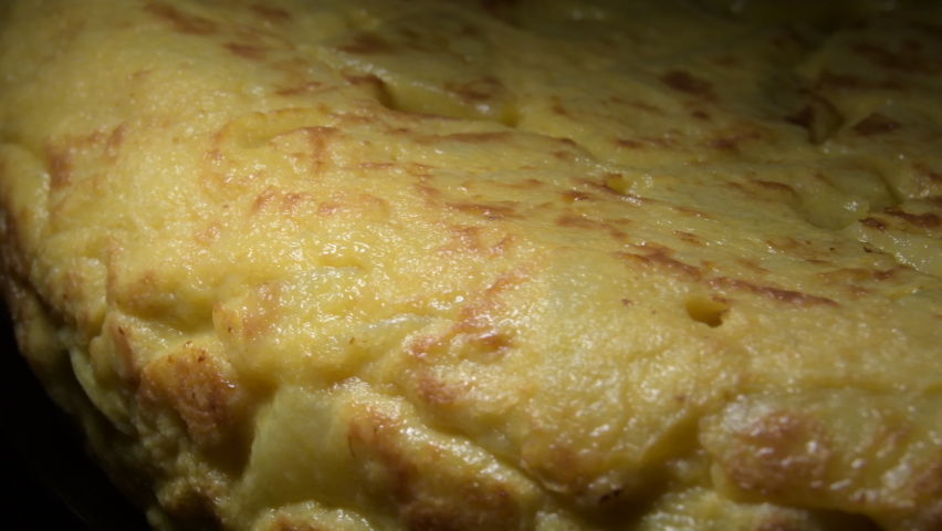 Tasty potato omelette edge rotating, Spanish omelette
