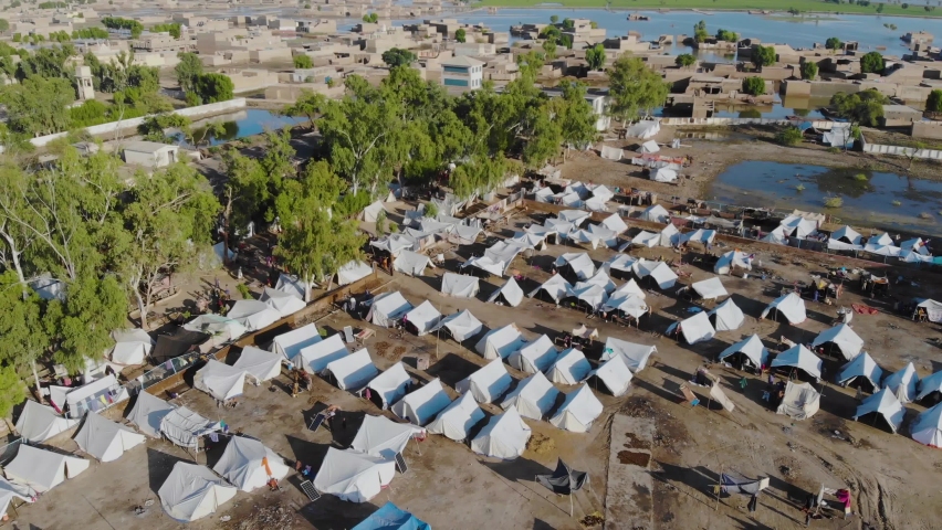 Aerial View Of Makeshift Camps For Flood Disaster Victims In Maher, Sindh. Descending Parallax Shot Royalty-Free Stock Footage #1096144733
