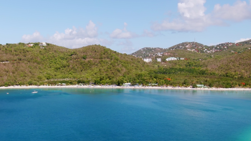 Soft aerial dolly right showing St Thomas beach in beautiful Caribbean waters