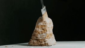 Closeup sculptor works with a special tool for carving stone figures. Cutting stone isolated on black background by hand. Processing with cinematic fragmentation - Powered by Shutterstock - Get 15% off with code: PIKWIZARD15