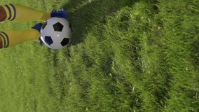 Football Player Kicks Ball with His Feet. Soccer Player Makes Pass, Close up, Slow motion. Soccer World Cup. Vertical Video