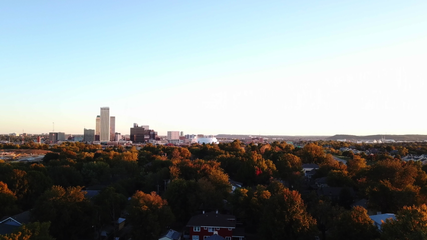 Aerial panorama shot of golden trees and high-rise buildings in Tulsa Town during autumnal day